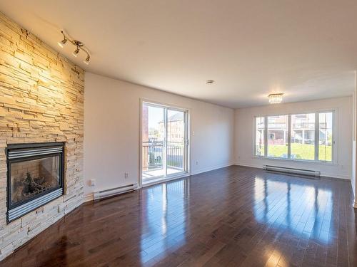 Living room - 4-4655 Ch. Des Prairies, Brossard, QC - Indoor With Fireplace