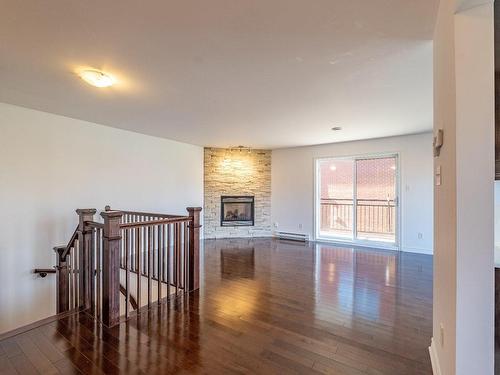 Salon - 4-4655 Ch. Des Prairies, Brossard, QC - Indoor Photo Showing Other Room With Fireplace