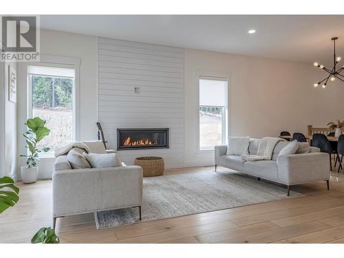 10285 Beacon Hill Drive, Lake Country, BC - Indoor Photo Showing Living Room With Fireplace