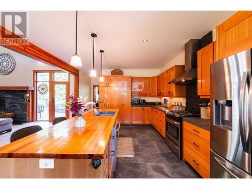 2442 Perrier  Lane, Nelson, BC - Indoor Photo Showing Kitchen With Fireplace With Upgraded Kitchen