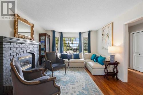 104 Christie Knoll Heights Sw, Calgary, AB - Indoor Photo Showing Living Room With Fireplace