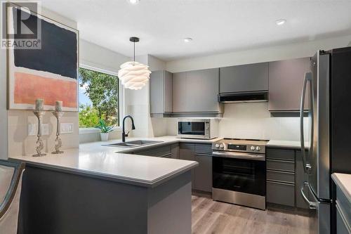 104 Christie Knoll Heights Sw, Calgary, AB - Indoor Photo Showing Kitchen With Stainless Steel Kitchen With Double Sink With Upgraded Kitchen