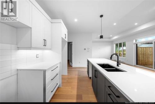 34 Vision Court, Dieppe, NB - Indoor Photo Showing Kitchen With Double Sink With Upgraded Kitchen