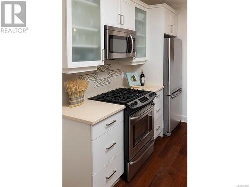 Kitchen detail including gas range. - 2 1146 Richardson St, Victoria, BC - Indoor Photo Showing Kitchen With Stainless Steel Kitchen