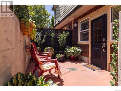 A sunny entrance patio provides abundant space for container gardening. - 2 1146 Richardson St, Victoria, BC - Outdoor With Deck Patio Veranda