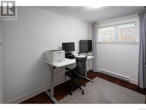 Bedroom used as home office with walnut flooring continued throughout. - 2 1146 Richardson St, Victoria, BC - Indoor Photo Showing Office