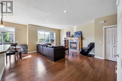 24 Copperstone Place Se, Calgary, AB - Indoor Photo Showing Living Room With Fireplace