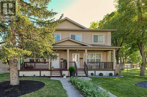 Charmingly stylish and next to a green space! Click the media link for virtual tour - 2417 53 Avenue Sw, Calgary, AB - Outdoor With Deck Patio Veranda With Facade