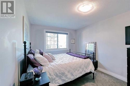 Primary bedroom upper floor - 2417 53 Avenue Sw, Calgary, AB - Indoor Photo Showing Bedroom