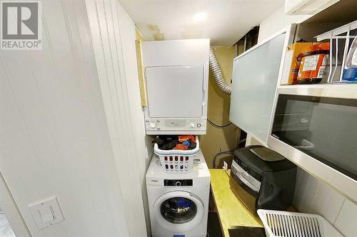 Laundry and cupboard space. Microwave negotiable - 2417 53 Avenue Sw, Calgary, AB - Indoor Photo Showing Laundry Room