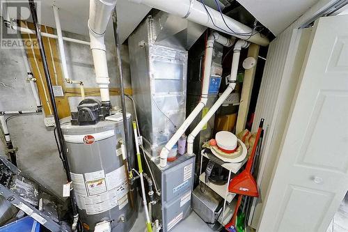 Upgraded high effeciency furnace and hot water tank - 2417 53 Avenue Sw, Calgary, AB - Indoor Photo Showing Basement