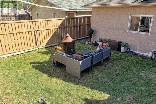 Ample yard space for trampoline or swingset.  Oversized double garage opens to rear lane - 2417 53 Avenue Sw, Calgary, AB - Outdoor With Exterior