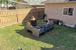 Ample yard space for trampoline or swingset.  Oversized double garage opens to rear lane - 