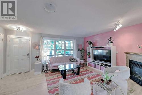 Plenty of room for designing your perfect space - 2417 53 Avenue Sw, Calgary, AB - Indoor Photo Showing Living Room With Fireplace