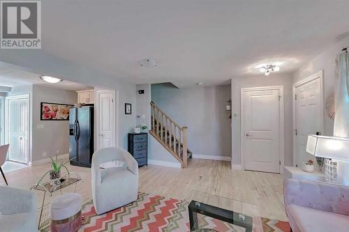 Hardwood throughout the main living area - 2417 53 Avenue Sw, Calgary, AB - Indoor Photo Showing Living Room