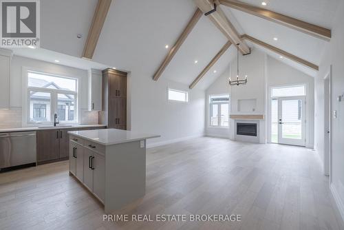 35 - 63 Compass Trail, Central Elgin (Port Stanley), ON - Indoor Photo Showing Kitchen With Fireplace