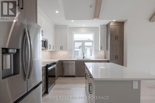 35 - 63 Compass Trail, Central Elgin (Port Stanley), ON - Indoor Photo Showing Kitchen With Upgraded Kitchen