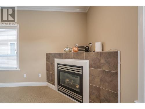 8542 St Lawrence Avenue, Prince George, BC - Indoor Photo Showing Living Room With Fireplace