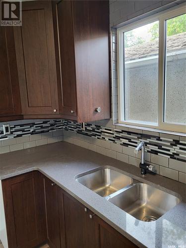 703-705 Weldon Avenue, Saskatoon, SK - Indoor Photo Showing Kitchen With Double Sink