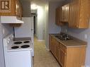 203 3094 5Th Avenue E, Prince Albert, SK  - Indoor Photo Showing Kitchen With Double Sink 