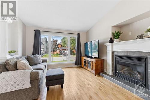 Living room with fireplace - 16 Lancelot Street, Embrun, ON 