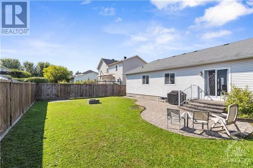 Backyard with interlock and firepit - 16 Lancelot Street, Embrun, ON 