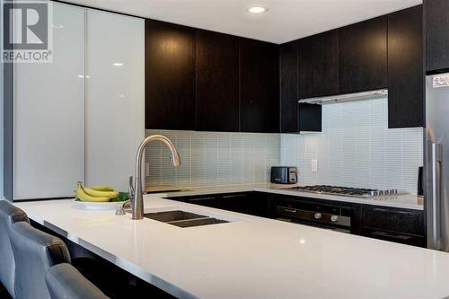 2203, 1111 10 Street Sw, Calgary, AB - Indoor Photo Showing Kitchen With Double Sink With Upgraded Kitchen