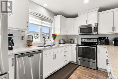 5545 Cederholm Avenue, Regina, SK - Indoor Photo Showing Kitchen With Stainless Steel Kitchen With Double Sink