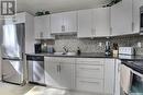 5 230 Broadway Avenue E, Regina, SK  - Indoor Photo Showing Kitchen With Double Sink 