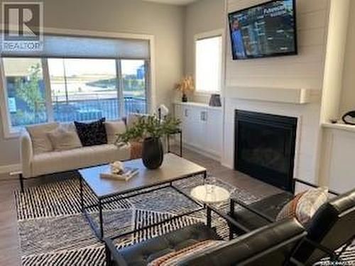 118 Katz Avenue, Saskatoon, SK - Indoor Photo Showing Living Room With Fireplace