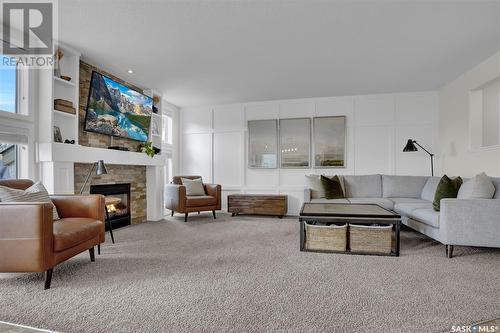 3640 Bishop Crescent E, Regina, SK - Indoor Photo Showing Living Room With Fireplace