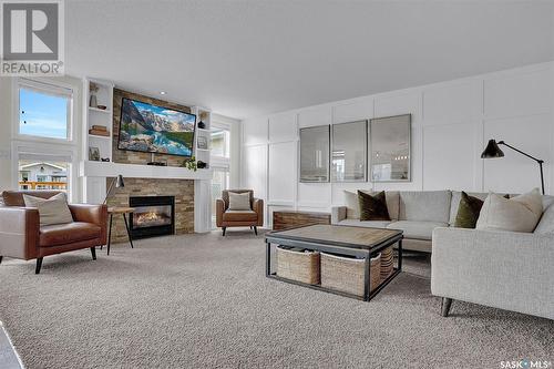 3640 Bishop Crescent E, Regina, SK - Indoor Photo Showing Living Room With Fireplace