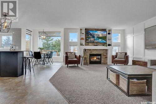 3640 Bishop Crescent E, Regina, SK - Indoor Photo Showing Living Room With Fireplace