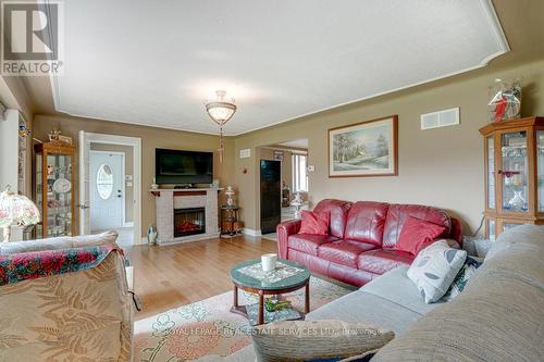 6949 Thorold Stone Road, Niagara Falls (Stamford), ON - Indoor Photo Showing Living Room With Fireplace