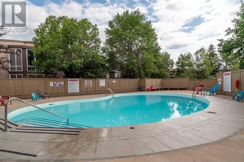 236, 820 89 Avenue Sw, Calgary, AB - Outdoor With In Ground Pool With Backyard