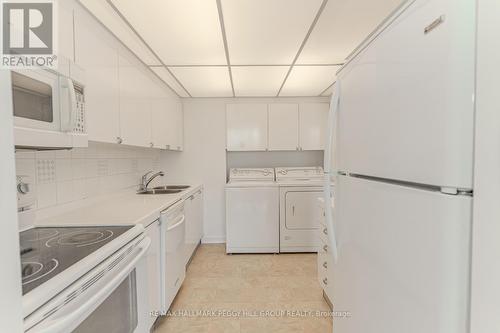 701 - 181 Collier Street, Barrie, ON - Indoor Photo Showing Laundry Room