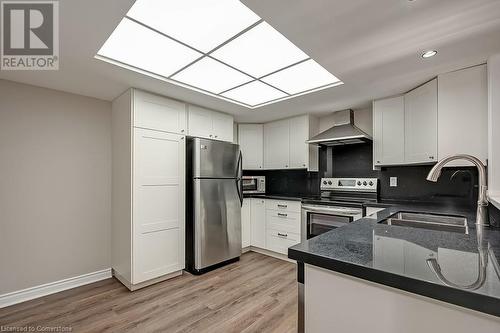 1237 North Shore Boulevard E Unit# 407, Burlington, ON - Indoor Photo Showing Kitchen With Stainless Steel Kitchen With Double Sink