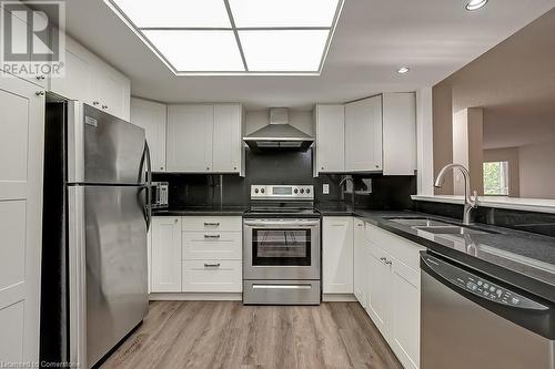 1237 North Shore Boulevard E Unit# 407, Burlington, ON - Indoor Photo Showing Kitchen With Stainless Steel Kitchen With Double Sink