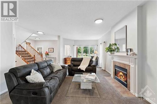 34 New Deighton Crescent, Ottawa, ON - Indoor Photo Showing Living Room With Fireplace