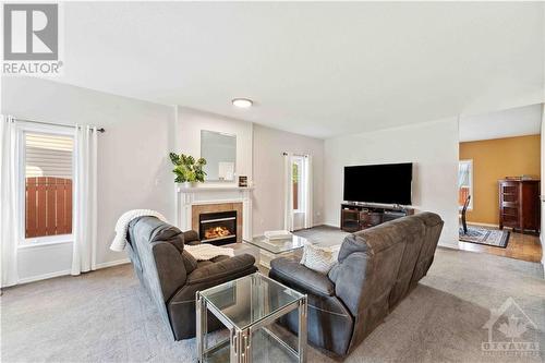 34 New Deighton Crescent, Ottawa, ON - Indoor Photo Showing Living Room With Fireplace