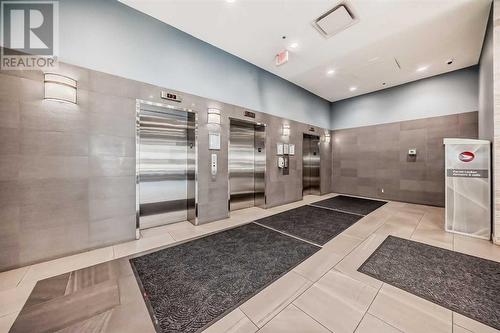 3 Hi speed elevators - 306, 1320 1 Street Se, Calgary, AB - Indoor Photo Showing Other Room