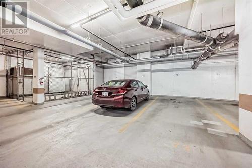 Titled u/g parking - 306, 1320 1 Street Se, Calgary, AB - Indoor Photo Showing Garage