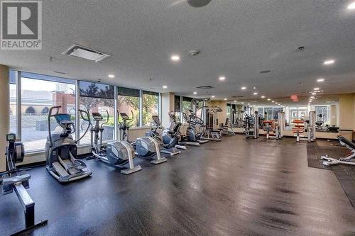 Fitness facility on the 2nd floor - 306, 1320 1 Street Se, Calgary, AB - Indoor Photo Showing Gym Room