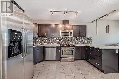 Large kitchen with loads of counter space - 306, 1320 1 Street Se, Calgary, AB - Indoor Photo Showing Kitchen With Upgraded Kitchen