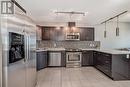 Large kitchen with loads of counter space - 306, 1320 1 Street Se, Calgary, AB  - Indoor Photo Showing Kitchen With Upgraded Kitchen 