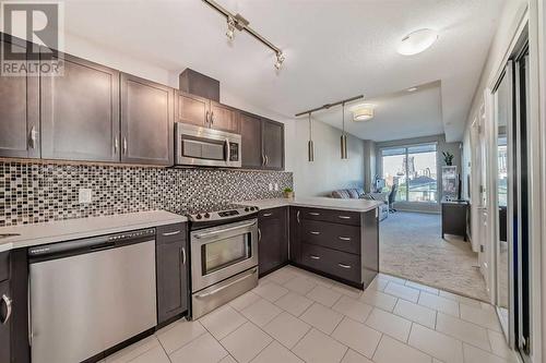 Open concept living - 306, 1320 1 Street Se, Calgary, AB - Indoor Photo Showing Kitchen With Upgraded Kitchen