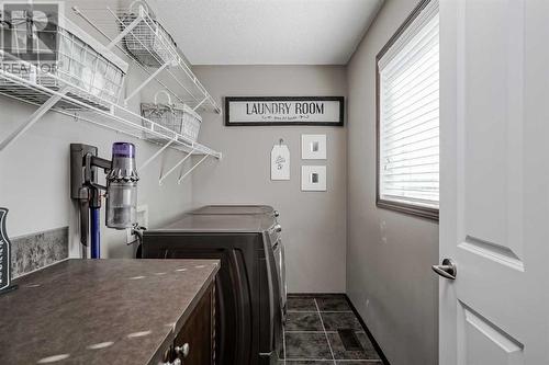 18 Chaparral Valley Place Se, Calgary, AB - Indoor Photo Showing Laundry Room