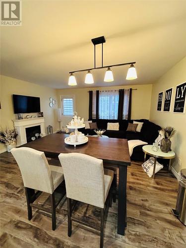 195 Main Street, Point Leamington, NL - Indoor Photo Showing Dining Room With Fireplace