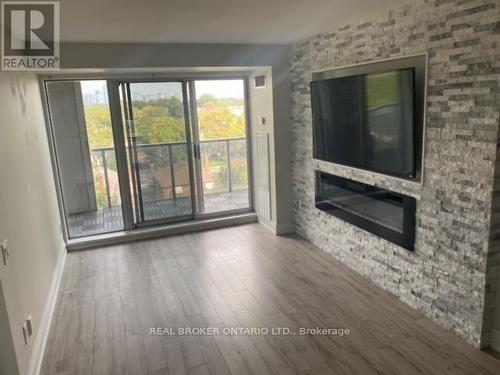 501 - 1040 The Queensway, Toronto, ON - Indoor Photo Showing Other Room With Fireplace