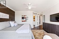 Primary bedroom, view towards ensuite bathroom - 